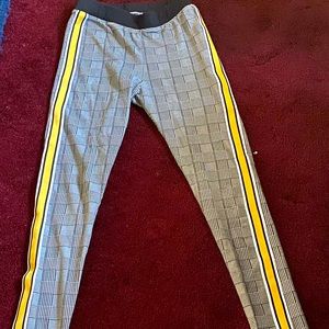 Black and white plaid pants with yellow stripes